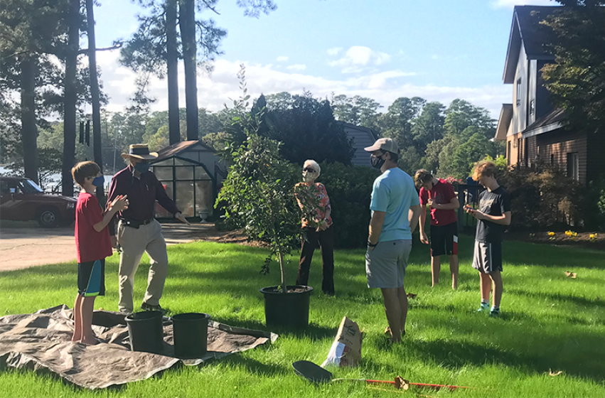 Anderson family planting the Emancipation Oak sapling